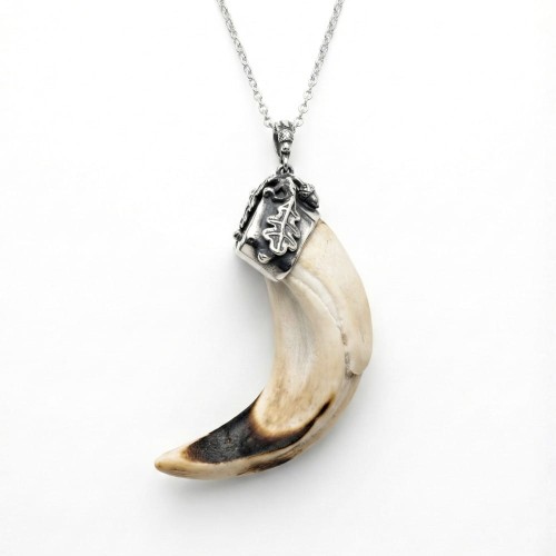Handcrafted necklace featuring a boar tusk