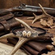 Hunting bracelet with roe deer canines – 925 silver on a forest background