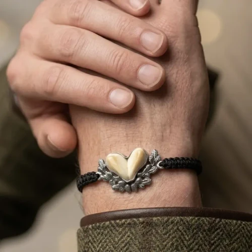Handmade deer ivory bracelet on an adjustable black braided cord